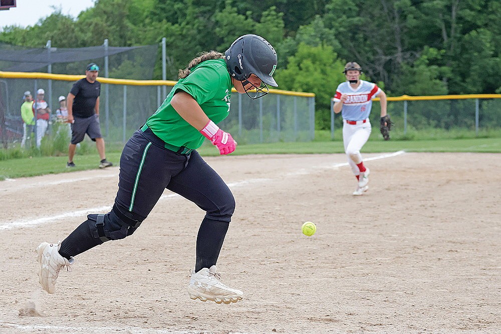 Rhinelander’s Kadyn Taylor bunts for a base hit during the seventh inning of an American Legion softball game at Crandon Tuesday, June 23. (Jeremy Mayo/River News)