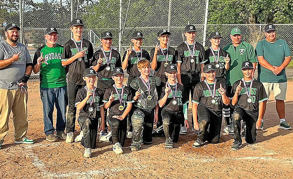 The 13U team poses with its medals after winning the championship. In the from row, from left to right, are Jeter Vander Galien, Korbin Skubal, Nick Schneider, Kolt Taylor, Landon Gauthier and Jacob Baumann. In the back row are coach Ben Gauthier, coach Jack Schneider, Griffin Rady, Casey Waksmonski, Marshal Towne, Cash Rushman, Brayden Rexford, coach Eric Rady and coach Dan Towne.