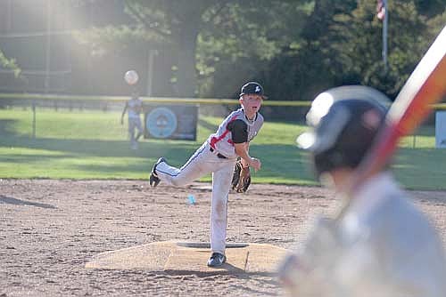 Easton Crass strikes out a batter in the fourth inning of a Babe Ruth Prep League game against Ironwood, Mich. Thursday, June 25 at the Minocqua Park Complex. (Photo by Brett LaBore/Lakeland Times)