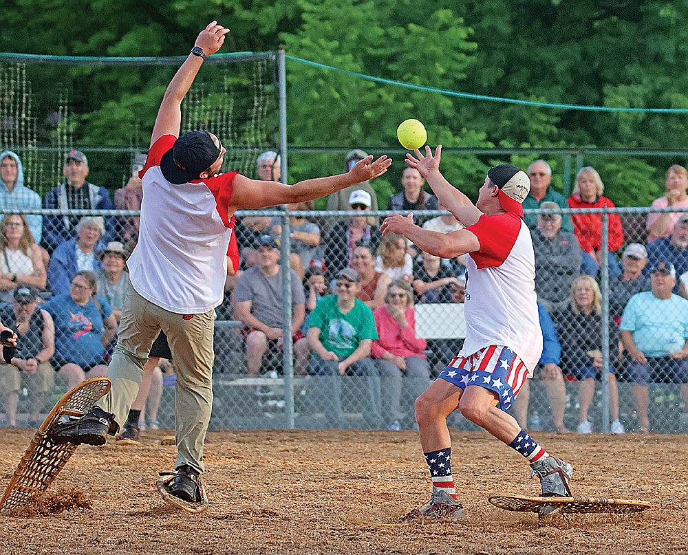 Chayce Walker, left, attempts to make a catch before Adam Redman hauls it in against the Snowhawks Monday, June 29 at Snowshoe Park in Lake Tomahawk. (Dean Hall/Lakeland Times)
