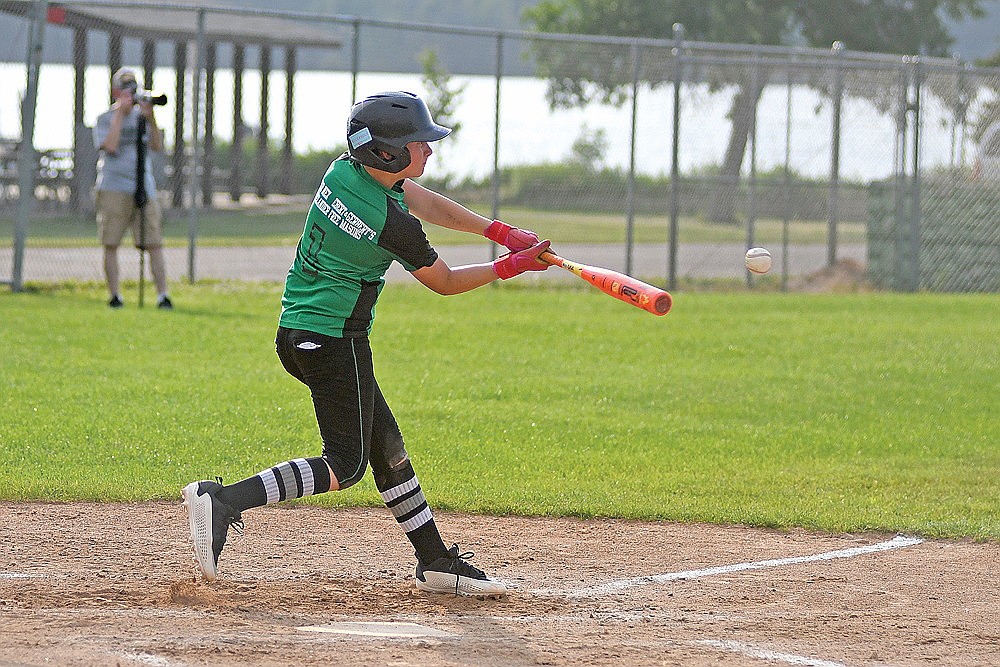 Rhinelander’s Will Sundby records a base hit during a Babe Ruth baseball game against Lakeland at Stafford Field Tuesday, June 30. (Brett LaBore/Lakeland Times)