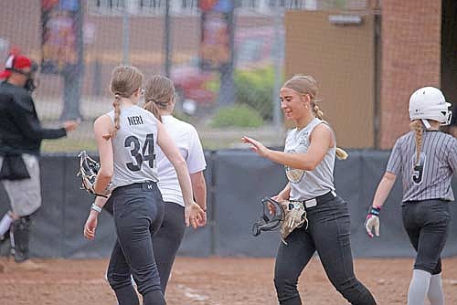 Lakeland’s Alena Bohne (right) looks to high-five Amelia Neri (34, left) after Neri squeezed the final out of the top of the fifth inning during a 14U softball game against Laona at Lenz Field in Minocqua July 8. Bohne pitched the final inning of Lakeland’s 12-1 win. (Photo by Blake Richard/River News)