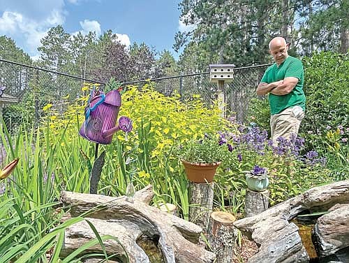 Tony Kramer observes the Aspirus Seasons of Life Garden during the inaugural GardenFest event on Saturday, July 22, 2023 in Woodruff. (Photo by Trevor Greene/Lakeland Times)