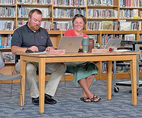The AV-W school district’s new principal Sid Hunter and district superintendent Dr. Jocelyn Hardy at the July 13 meeting of the school board. The meeting was the first for Hunter as AV-W principal. A former AV-W and Lakeland Union High School student, Hunter had been on the administrative staff at the Minocqua Hazelhurst Lake Tomahawk (MHLT) school district before he was hired by the AV-W school board in February, succeeding the retired Rich Fortier. (Photo by Brian Jopek/Lakeland Times)