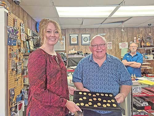 Ron Gaber (right) and Rhinelander Community Foundation Treasurer Shannon Campy display gold coins that provided a $96,000 donation to the Ron and Elsie Gaber Grants for Greater Good Endowment Fund. (Contributed photograph)