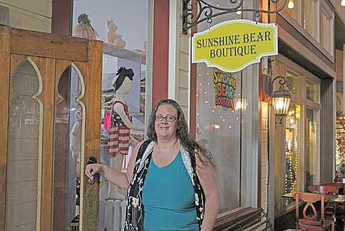 Sunshine Bear Boutique owner Jennifer Zier stands outside her store in Gaslight Square Mall in downtown Minocqua on Thursday, July 16. (Photo by Jacob Link/Lakeland Times)