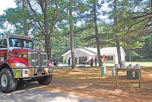 A tender with the St. Germain fire department was one of the trucks used by department personnel to respond to the call of a vehicle fire in an attached garage at a residence on Sunrise Lane in St. Germain on Monday, July 20. (Photo by Brian Jopek/Lakeland Times)