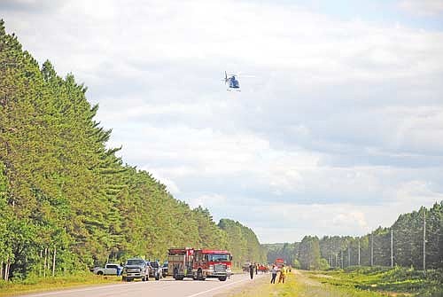 A medical helicopter takes off from a landing zone that had been established on State Highway 47 in Lake Tomahawk following a motorcycle versus deer accident on Wednesday, July 22. (Photo by Brian Jopek/Lakeland Times)