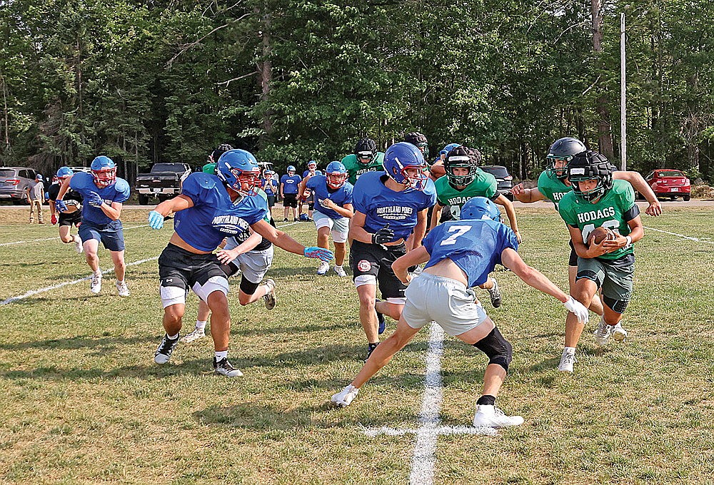 Rhinelander’s Canyon Sizemore carries the ball during a Hodag football team camp in front of the Hodag Dome Thursday, July 23. The Hodags ended their four-day team camp with a joint camp session with Northland Pines High School. (Bob Mainhardt for the River News)