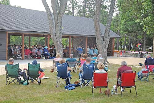 The first service at the Boulder Junction Community Church’s new Gathering Place Pavilion on Sunday, July 26. Following the service and a ribbon cutting those in attendance were treated to lunch. (Photo by Brian Jopek/Lakeland Times)