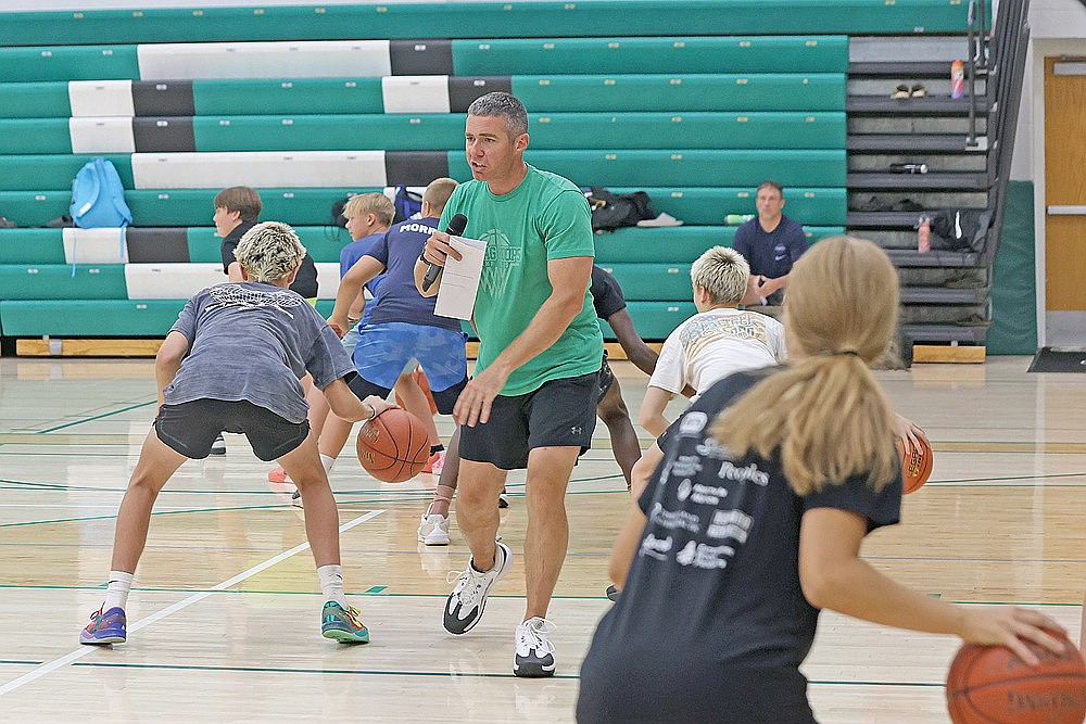 Rhinelander High School boys’ basketball coach Derek Lemmens instructs players during the annual Hodag Hoops Camp at the Jim Miazga Community Gymnasium Monday, July 27. Lemmens said the four-day camp, for players entering kindergarten to ninth grade, attracted more than 140 athletes. (Bob Mainhardt for the River News)