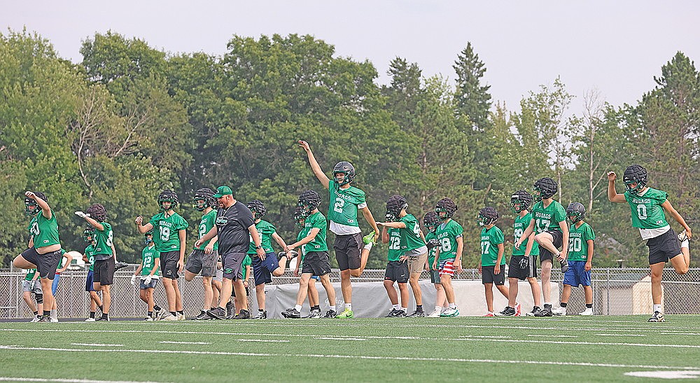 Players stretch during Rhinelander High School football practice at Mike Webster Stadium Tuesday, Aug. 4. Tuesday marked the first day of fall practice for high school football teams in the state. (Bob Mainhardt for the River News)