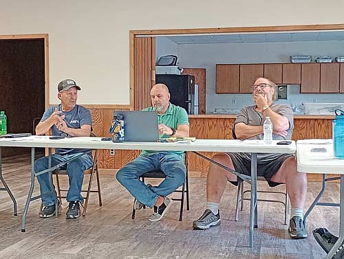 At last Tuesday’s Stella town board meeting, town supervisors (l-r) Rich Hirman, chairman Casey Crump, and Jerome Pokorny ponder possibilities for rentals of the town hall going forward. (Photo by Ardith Carlton/River News)