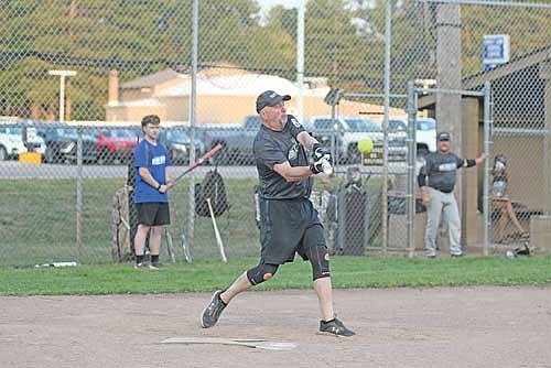 Eric Hagge takes a swing during a Minocqua Men’s Softball League game against Black Bear Thursday, Aug. 6 at the Minocqua Ball Park. Hagge has been playing in the league for 47 years. (Photo by Brett LaBore/Lakeland Times)