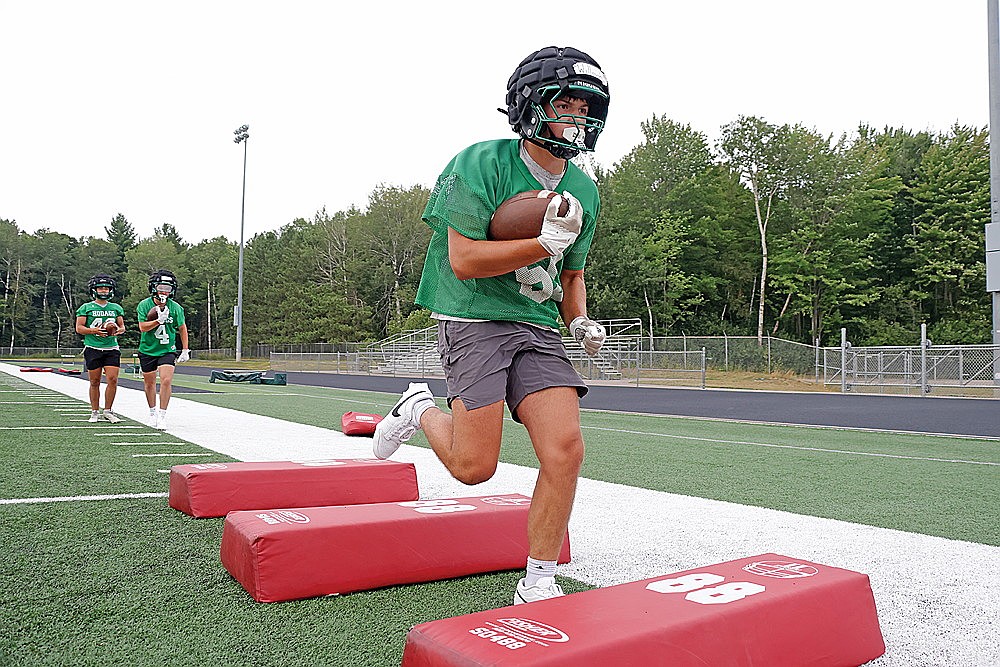 Josh Willoughby runs through an agility drill during Rhinelander High School football practice at Mike Webster Stadium Tuesday, Aug. 4. Willoughby, a senior, leads a relatively inexperienced backfield for the Hodags this fall. His 37 carries last season are the most for any returning player on the roster. (Jeremy Mayo/River News)