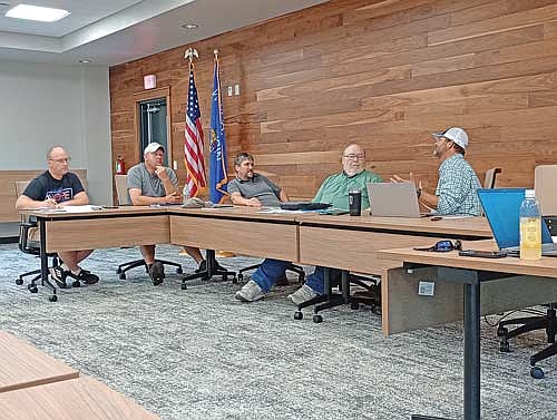 From left, Newbold Plan Commission members Jeff Pennucci, Ryan Rezny, Nick Vos and Bill Jaeger listen to Scott Ridderbusch’s rationale for including condominiums in Chapter 13 of the Newbold Town Ordinance at their Aug. 6 meeting. (Photo by Ardith Carlton/River News)