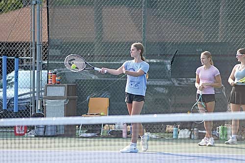 Sophia Hella hits the tennis ball during a drill on the first day of the season Monday, Aug. 10 at the Lakeland Union High School tennis courts in Minocqua. (Photo by Brett LaBore/Lakeland Times)