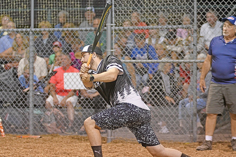 Jacob Hodgdon, Black Bear Bar, hits an RBI single in the eighth inning of a snowshoe baseball game against the Snowhawks Monday, Aug. 10 at Snowshoe Park in Lake Tomahawk. (Brett LaBore/Lakeland Times)