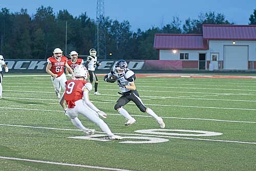 In this Sept. 18, 2025 file photo, Mason Schettino carries the ball in a conference game against Medford at Raider Field in Medford. (Photo by Brett LaBore/Lakeland Times)