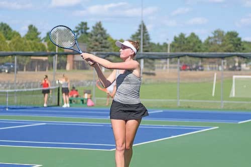 Nora DeVries uses a backhanded groundstroke to return the ball in her No. 2 doubles match against Wausau East Monday, Aug. 17 at the Lakeland Union High School tennis courts in Minocqua. DeVries and partner Carmen Istudor won 6-1, 6-1. (Photo by Brett LaBore/Lakeland Times)