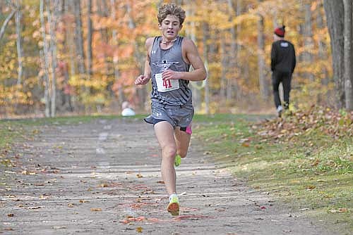 In this Oct. 18, 2025 file photo, Charlie Ernst runs in the Great Northern Conference meet at Northwood Golf Club in Rhinelander. Ernst finished runner-up in the meet and first team all-conference a year ago. (Photo by Brett LaBore/Lakeland Times)
