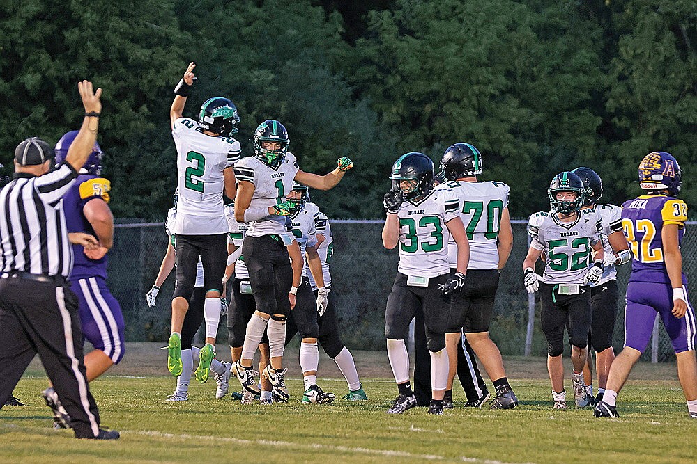 Rhinelander’s Abe Gretzinger (2) and Rowan Wiczek (1) celebrate after hooking up for a touchdown pass during the third quarter of a non-conference football game at Ashland Friday, Aug. 21. Gretzinger threw two touchdown passes to Wiczek and the Hodags rallied for 20 unanswered points in the second half to defeat the Oredockers, 20-7. (Bob Mainhardt for the River News)