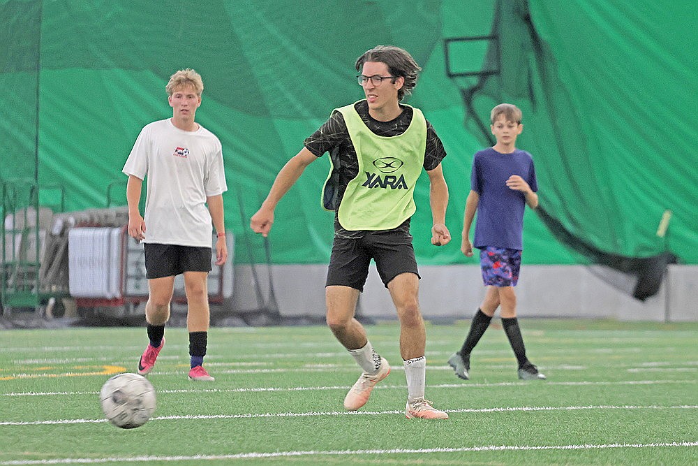 Asher Rivord possesses the ball during Rhinelander High School boys’ soccer practice in the Hodag Dome Monday, Aug. 17. Rivord, a senior, earned second-team honors in the Great Northern Conference last season and led the team in scoring. (Jeremy Mayo/River News)