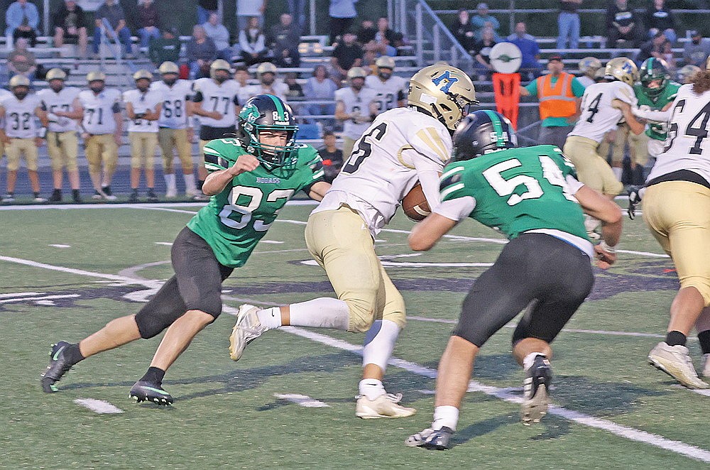 Rhinelander’s Knox Fleming (83) and Marshal Durkee (54) combine to tackle Hayward’s Gabe Bisonette during a non-conference football game at Mike Webster Stadium Friday, Aug. 28. The Hodag run defense will be put to the test Friday against Will Wojcik and the Medford Raiders in the Great Northern Conference opener. (Bob Mainhardt for the River News)