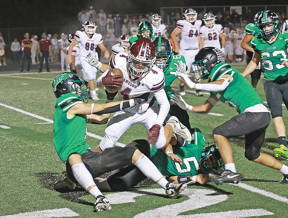 In this Sept. 26, 2025 file photo, Antigo’s Owen Medo (4) is tackled by the Rhinelander defense, led by Rowan Wiczek (1) and Josh Willoughby (6) during the 91st playing of the Bell Game at Mike Webster Stadium. The long time rivals renew acquaintances tonight in Rhinelander. (Bob Mainhardt for the River News)