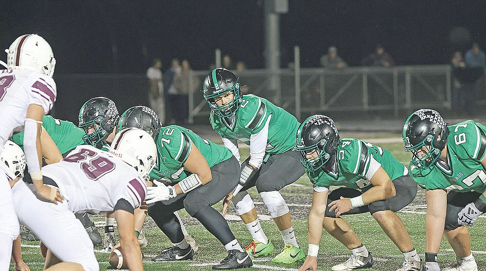 Rhinelander’s quarterback Abe Gretzinger surveys the field prior to a snap during the 92nd Bell Game at Mike Webster Stadium Friday, Sept. 18. Gretzinger, who has put up career-high passing yards in back-to-back weeks will face a challenge tonight against a Hatchet secondary that’s allowing only 73.6 passing yards per game.