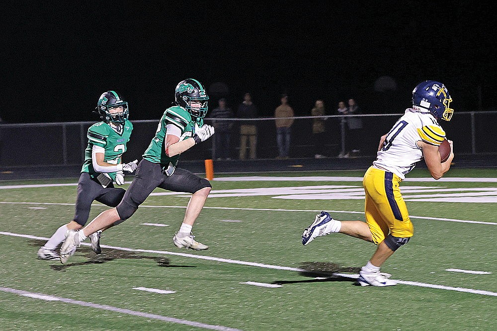 Rhinelander’s Ryley Hull (3) and Gage Anderson (52) chase Tomahawk’s Colin Black (10) during the third quarter of a GNC football game at Mike Webster Stadium Friday, Sept. 25. Tomahawk scored on the play and defeated the Hodags, 28-14.
