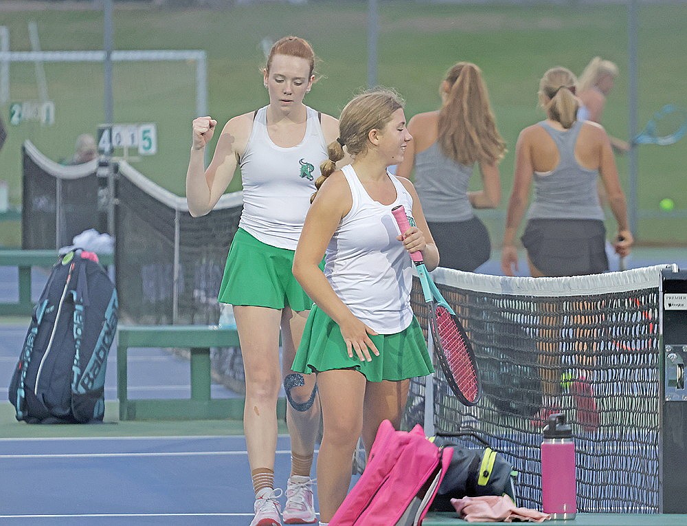 Rhinelander’s Alexia Corey-Luse pumps her fist while teammate Addy Strobel smiles after the two defeated Lakeland’s McKenna Byram and Katy Janowiec in a No. 2 doubles match during a GNC girls’ tennis dual meet in Minocqua Thursday, Sept. 24. Rhinelander defeated Lakeland 5-2 in a battle of conference unbeatens and takes a 14-point lead over the T-Birds into this coming Thursday’s GNC tournament in Wausau.