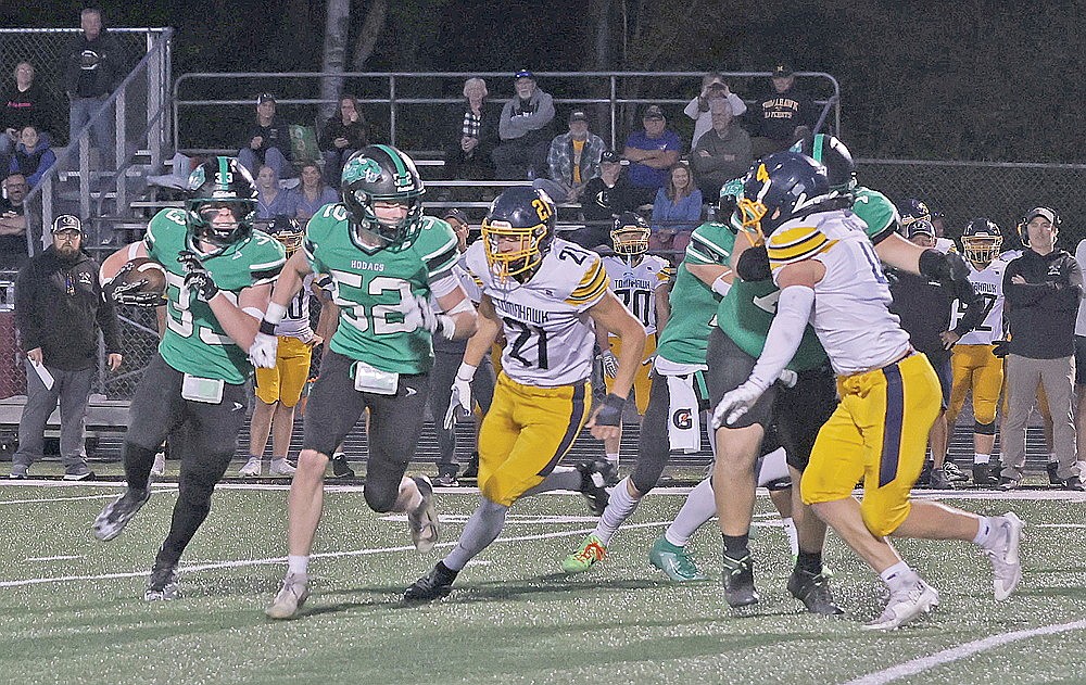 Rhinelander’s Matthew Haselton (33) carries the ball with a lead block from Gage Anderson (52) during a GNC football game against Tomahawk at Mike Webster Stadium Friday, Sept. 25. The Hodags, coming off a 28-14 loss to the Hatchets, look to rebound Saturday at Merrill.