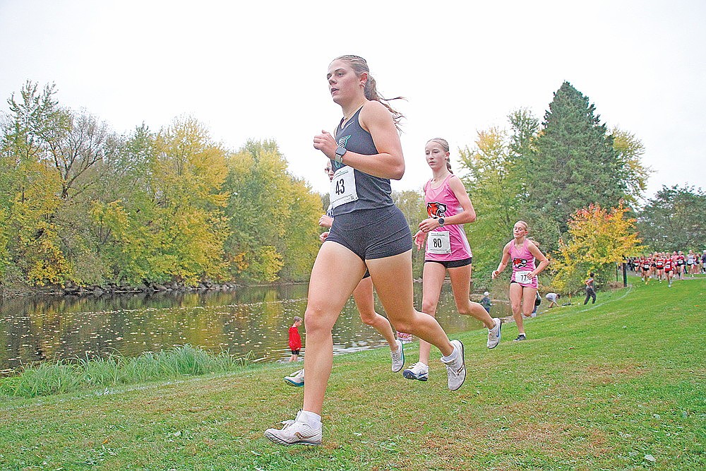 Rhinelander’s Macy Myers leads Stratford’s Charlotte Pierce (80) during the opening mile of the Athens Invite at Erbach Park in Athens Thursday, Oct. 1. Myers finished second overall in the girls’ race, 16 seconds behind Pierce.