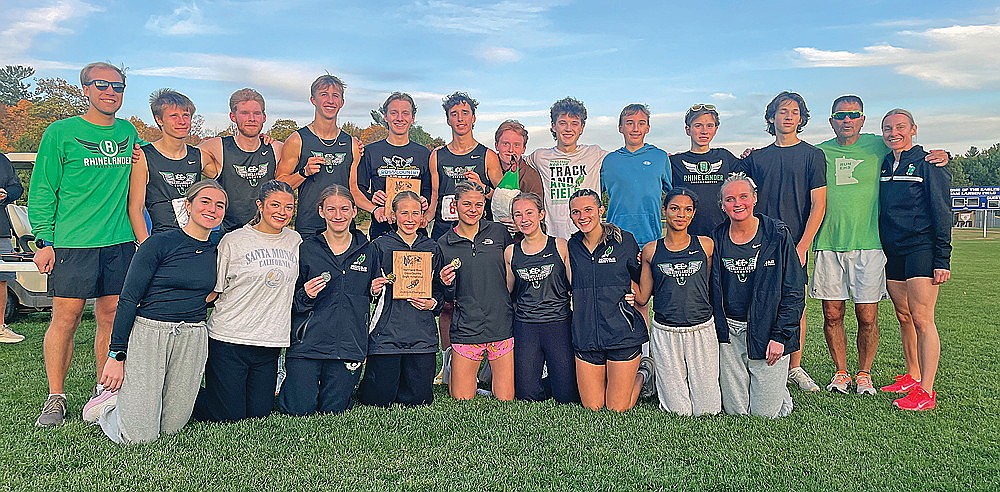 The Rhinelander High School boys’ and girls’ cross country teams pose with their plaques after winning the Northland Pines Invitational in Eagle River Tuesday, Oct. 6. Pictured in the front row, from left to right, are Gretchen Fiebke, Alexa Segovia, Noelle Mayo, Kara Monk, Macy Myers, Emily Schiek, Maddie Collins, Gabby Wanta and Lucy Eddy. In the back row are coach Bennett Rozek, Michael Brunette, Jonathan Campbell, Jackson Weinzatl, Grant Gremban, Avrom Barr, Logan Creapeau, Wyatt Crowell, Ryder Clark, Matthew Wood, Chasin Wallmow, head coach M.J. Laggis and coach Tara Gremban. Team members Collin Rappley, Charlotte Halada, Helen Beuning and Addie Olson were unavailable for the photograph.