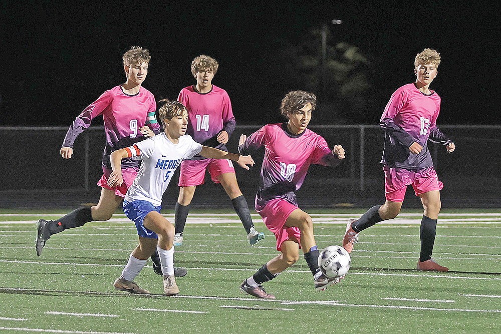 Rhinelander’s Santiago Martinez Rodriguez (18) battles Merrill’s Caleb Gennrich for the ball as Hodag teammates Kamden Kostrova (9), Landon Catlin (14) and Hunter Choinski (13) watch the play during a GNC boys’ soccer game at Mike Webster Stadium Thursday, Oct. 8.