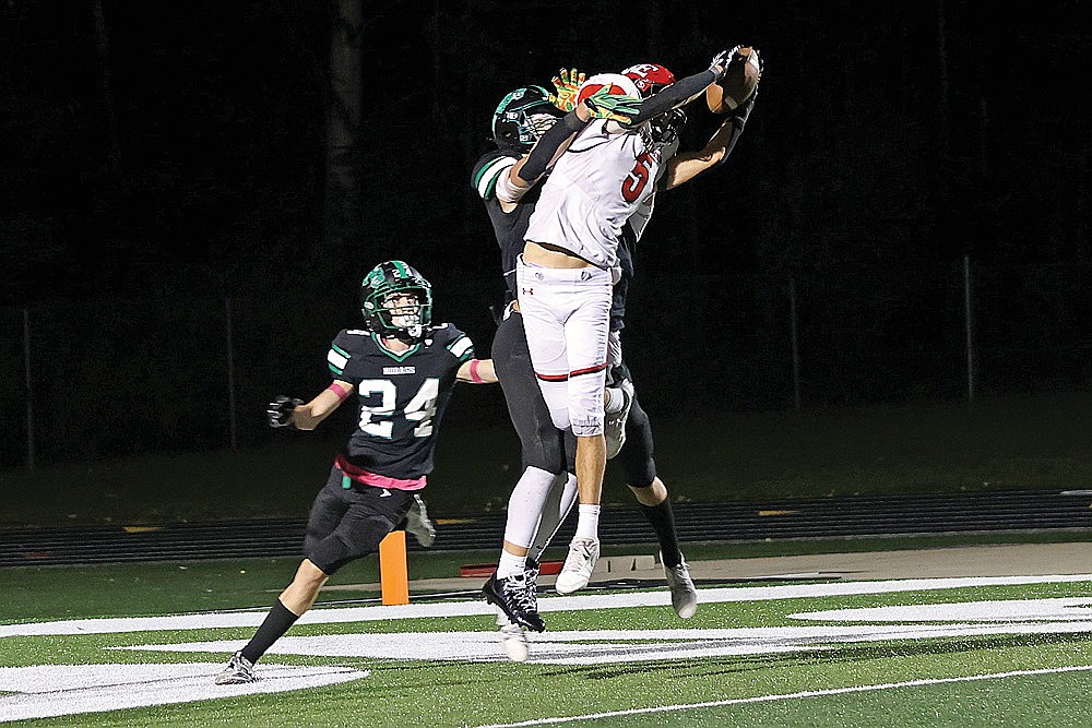 Bob Mainhardt for the River News
Wausau East’s Henry Maahs catches a pass against the coverage of Rhinelander’s Rowan Wiczek Jaxon West (24) and Ryley Hull (obscured) during the third quarter of a GNC football game at Mike Webster Stadium Friday, Oct. 9. The catch was ruled a touchdown, part of a 21-point comeback as the Lumberjacks defeated the Hodags, 25-21 on Rhinelander’s homecoming night.
