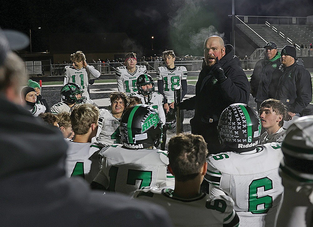 Rhinelander High School football coach Aaron Kraemer addresses his team following a 27-14 win against Lakeland in Minocqua Friday Oct. 16. The Hodags are making their sixth playoff appearance in Kraemer’s eight seasons as head coach and looking for their first road playoff victory.