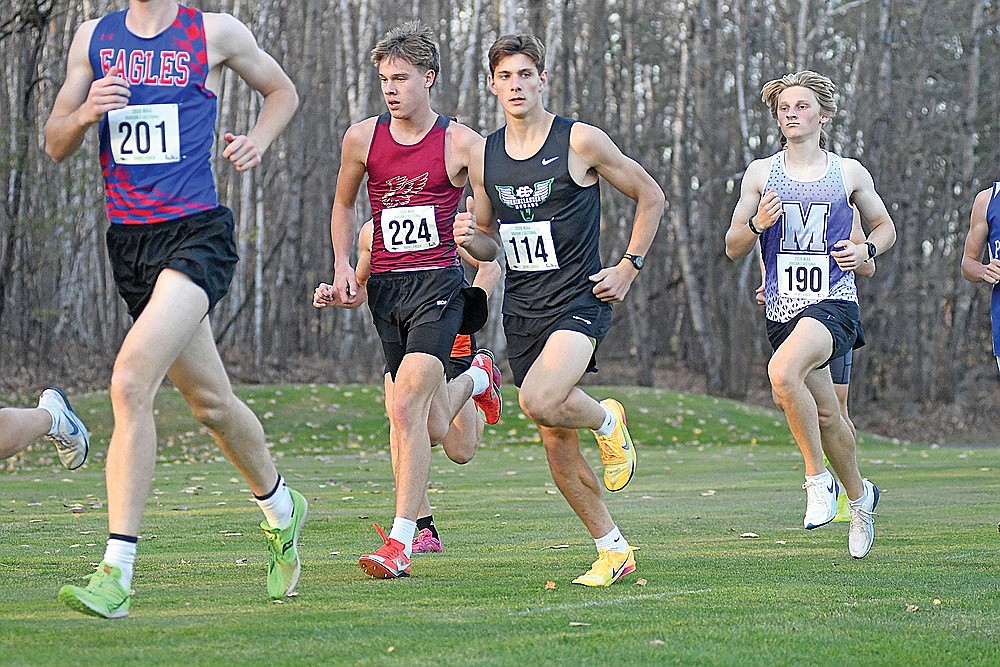 Rhinelander’s Dean Gillingham runs with Rib Lake/Prentice’s Jackson Schutt during a WIAA Division 2 cross country sectional at Northwood Golf Club in Rhinelander Friday, Oct. 23. Gillingham finished fourth overall in the boys’ race to qualify for the WIAA state meet.