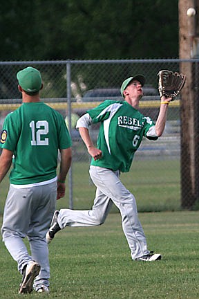 Schmidt's arm helps Rebels to a split