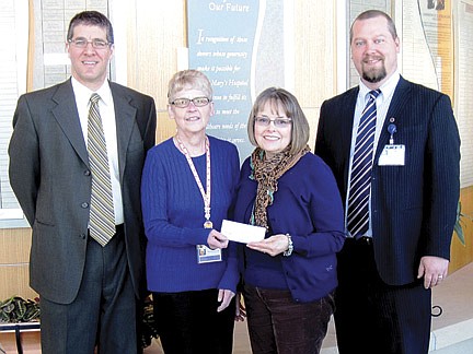 Volunteers of Ministry Saint Mary's Hospital donate to SMH Foundation