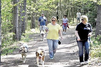 Dogs and owners get their exercise  during Tails on the Trail event
