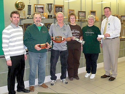 Class of 1964 donates a wooden football, photobook, $3,000 for 3-D sign