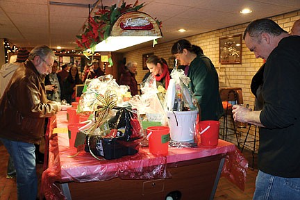 'Christmas for the Critters' benefit draws animal lovers to Pat's Tavern