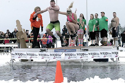 Over 100 take icy dip for a good cause at 15th annual Polar Bear Plunge