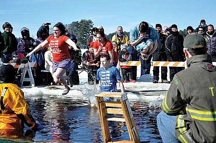 Taking the plunge: Brave souls support Kinship with icy dip