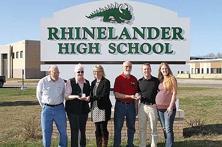 RASF presents gold Hodag pendants to two couples
