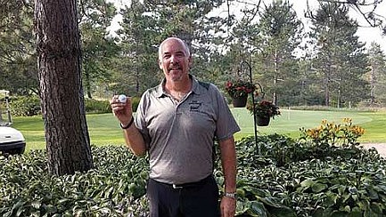 Photo: Robinson records ace at Pinewood