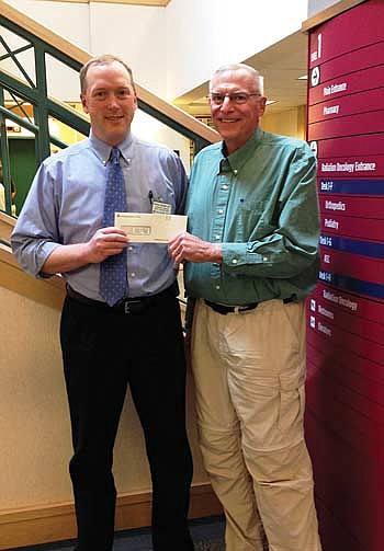 Marshfield Clinic makes annual  contribution to homeless shelter