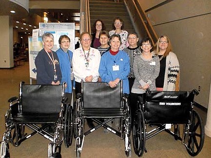 Ministry volunteers donate wheelchairs